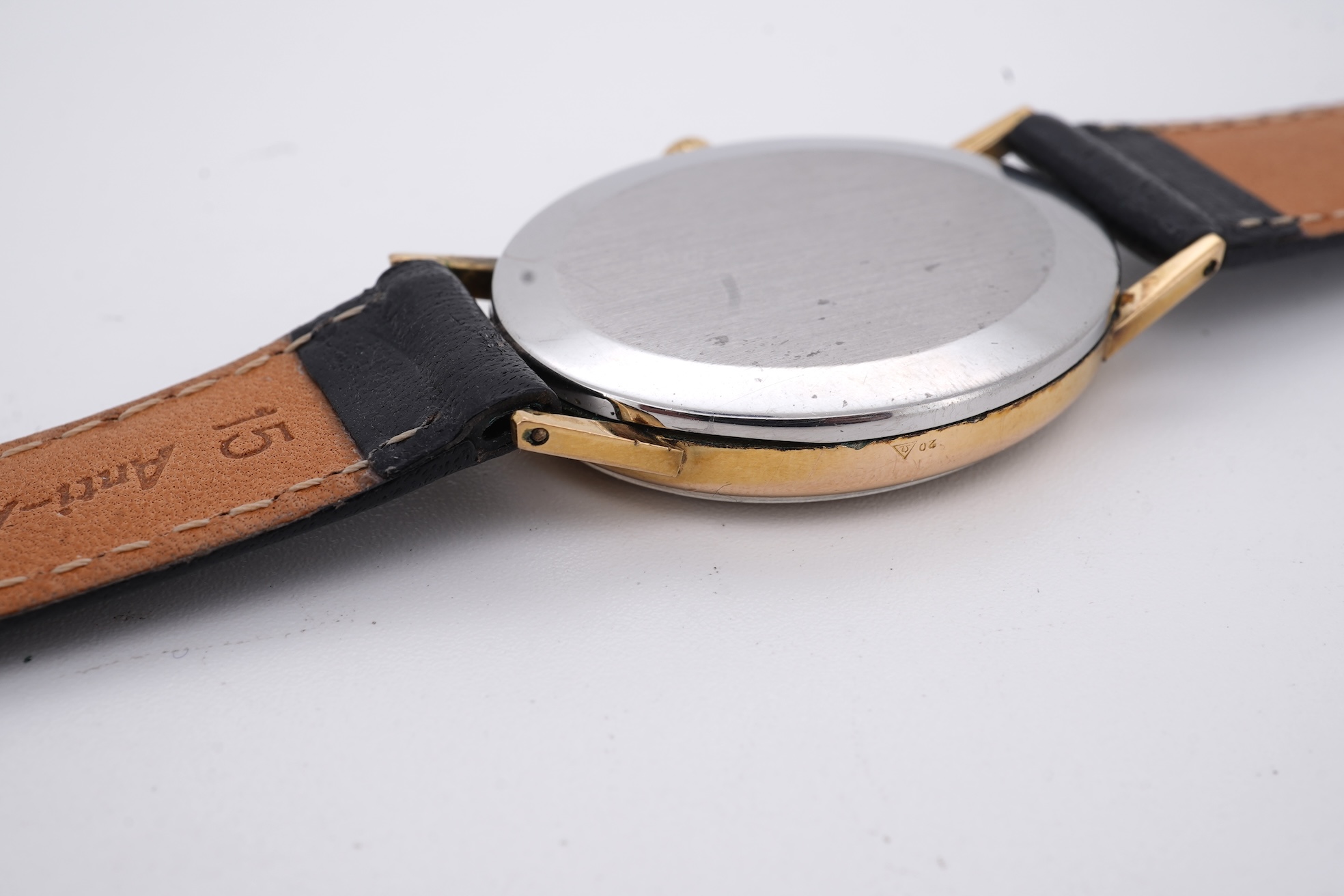 A lady's early 1970's steel and gold plated Omega manual wind wrist watch, with oval dial and baton numerals, case diameter 26mm, movement c.620, on an associated leather strap, with box no papers.
